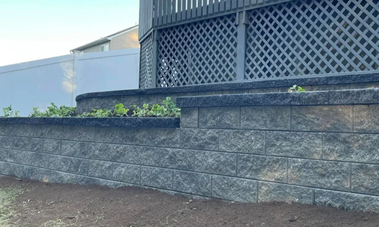 Will a retaining wall solve my drainage problems?